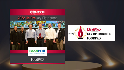 FoodPRO celebrates 2022 UniPro Key Distributor award at recognition event with trophy and team.