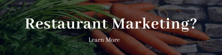 Vibrant carrots on rustic stones highlight fresh produce in restaurant marketing strategies.